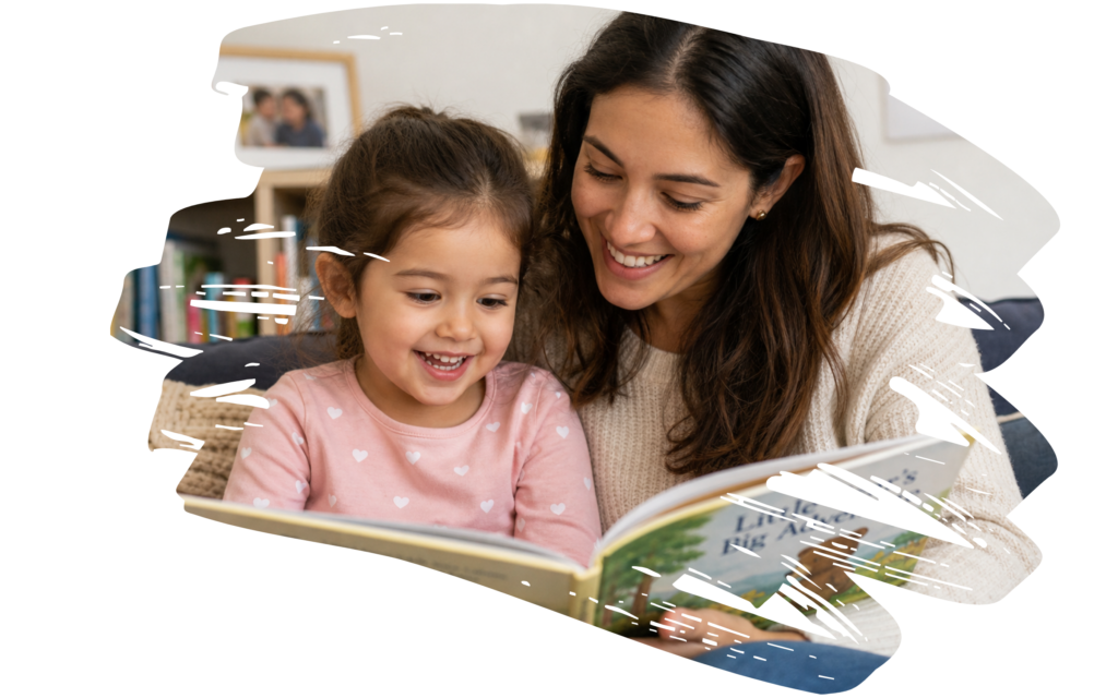 A smiling woman and young girl reading a book together indoors, sharing a joyful moment.