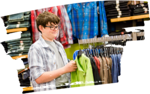Teenage boy working in clothing store